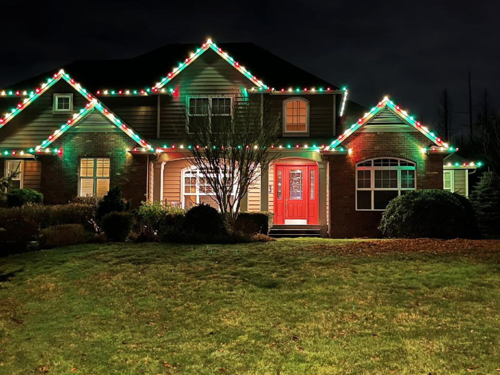home-wth-holidays-lights-at-night home with holiday lights at night.